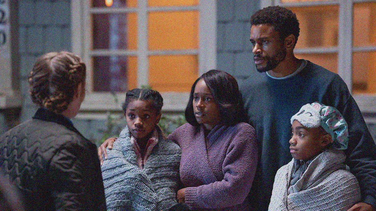 A white policewoman confronts a Black family in front of their home at night.