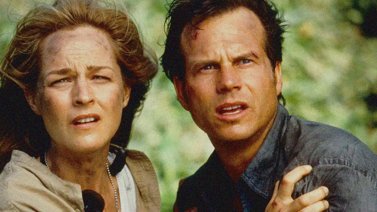 Close-up of a woman and man side-by-side staring behind the camera with mouths agape.