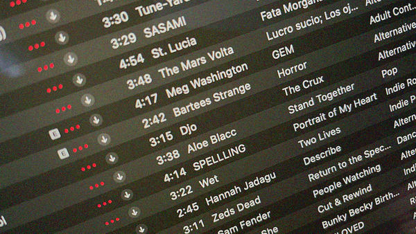 Close-up of an iTunes playlist including artists like SASAMI, St. Lucia, Bartees Strange, Djo, SPELLLING, and Sam Fender.